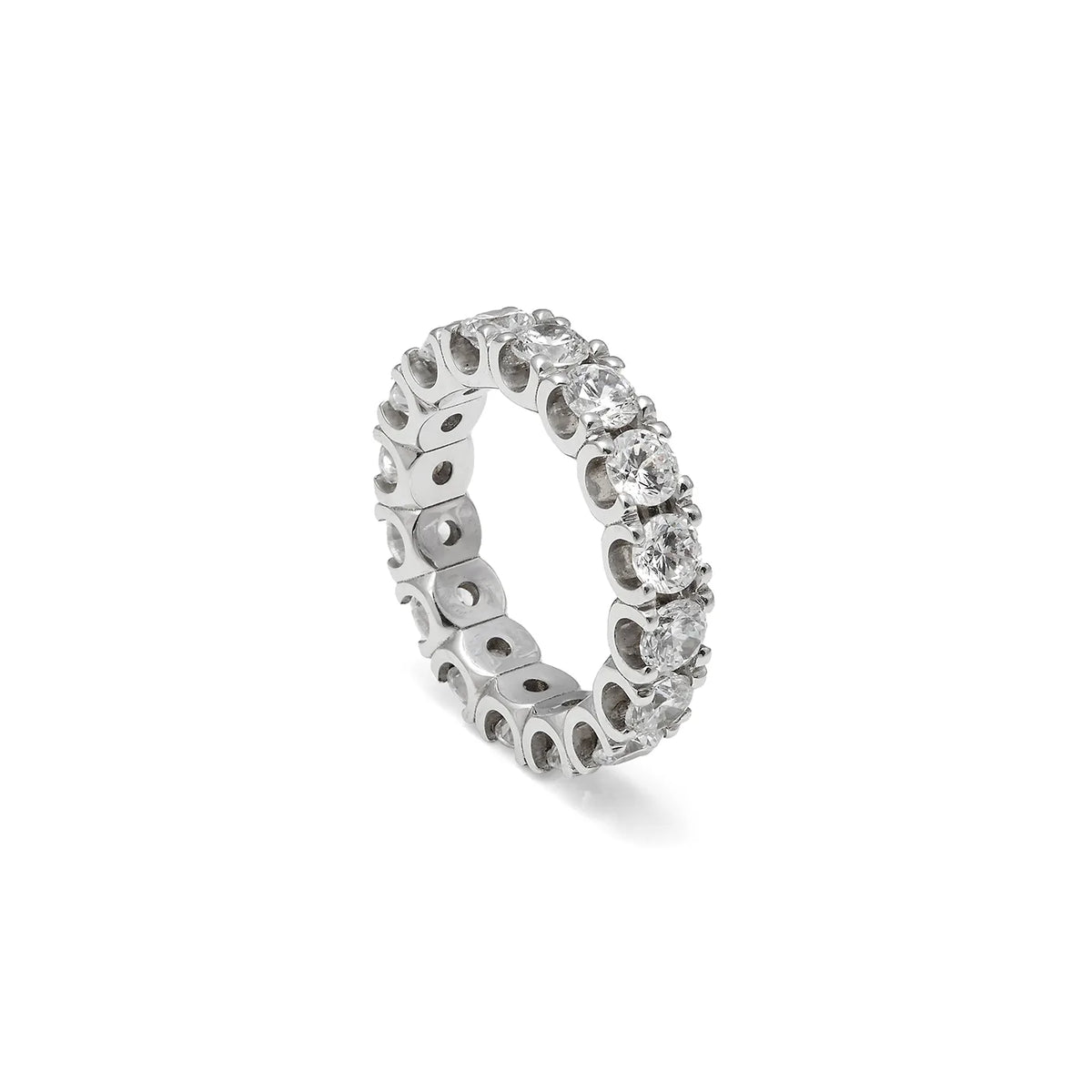 Alianza de contorno luminoso y garras. Las garras de tono plateado perfilan la sucesión de piedras incoloras.