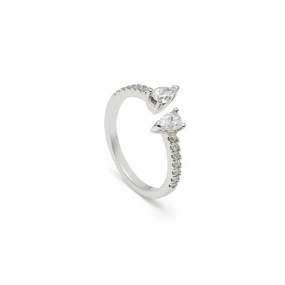 Anillo abierto con motivos de lágrima. Los extremos luminosos se orientan en sentidos opuestos.