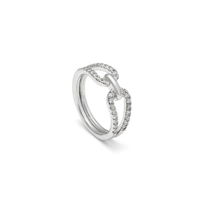 Anillo de lazo y línea luminosa. El motivo central conecta las bandas en la zona del encuentro.