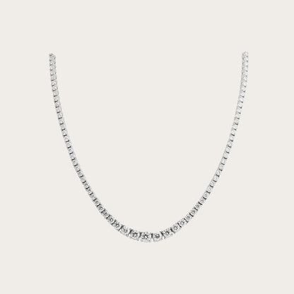 Collar rivière de línea luminosa. Las piedras incoloras forman una línea continua en la zona frontal.