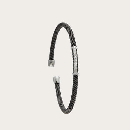 Pulsera de acero, oro y brillantes. El motivo frontal sigue una línea ligeramente curva.