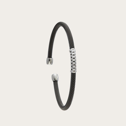 Pulsera de acero y oro con hilera de brillantes. Los pequeños centros se presentan en monturas diferenciadas.