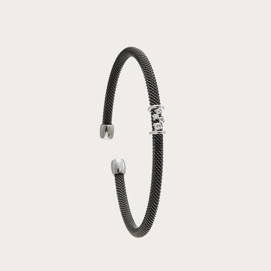 Pulsera de acero y oro de motivos geométricos. Las pequeñas monturas se suceden en el frente alargado.