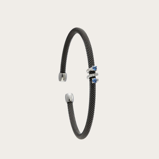 Pulsera de acero con pequeños centros azules. Las monturas del frente dibujan una sucesión vertical.
