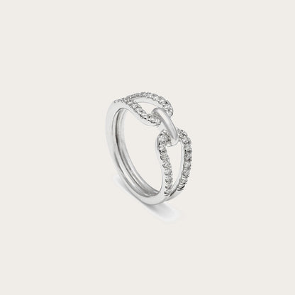 Anillo de lazo y línea luminosa. El motivo central conecta las bandas en la zona del encuentro.
