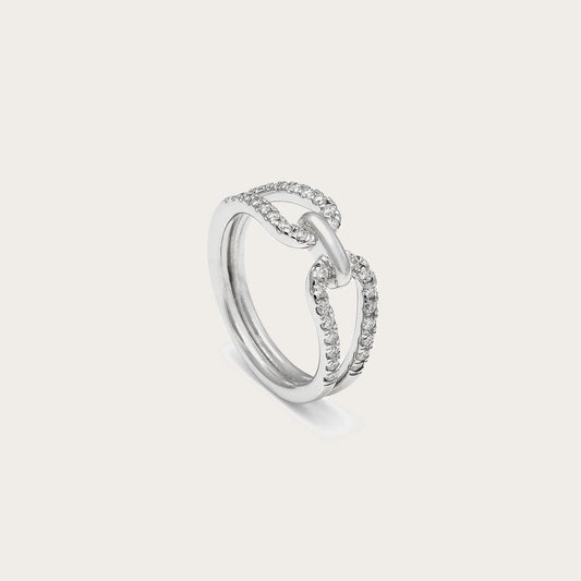 Anillo de lazo y línea luminosa. El motivo central conecta las bandas en la zona del encuentro.