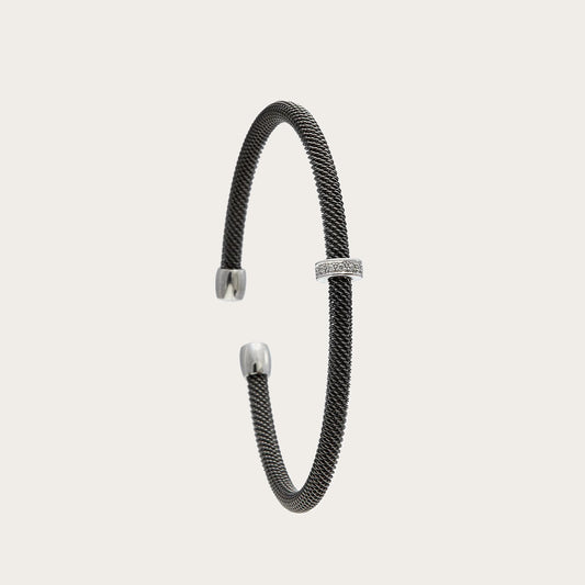 Pulsera de acero y pequeña barra de luz. Las piedras incoloras se alinean dentro del motivo frontal.