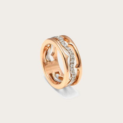 Anillo de curvas caladas y destellos. Los huecos del frente permiten seguir el recorrido de las bandas.