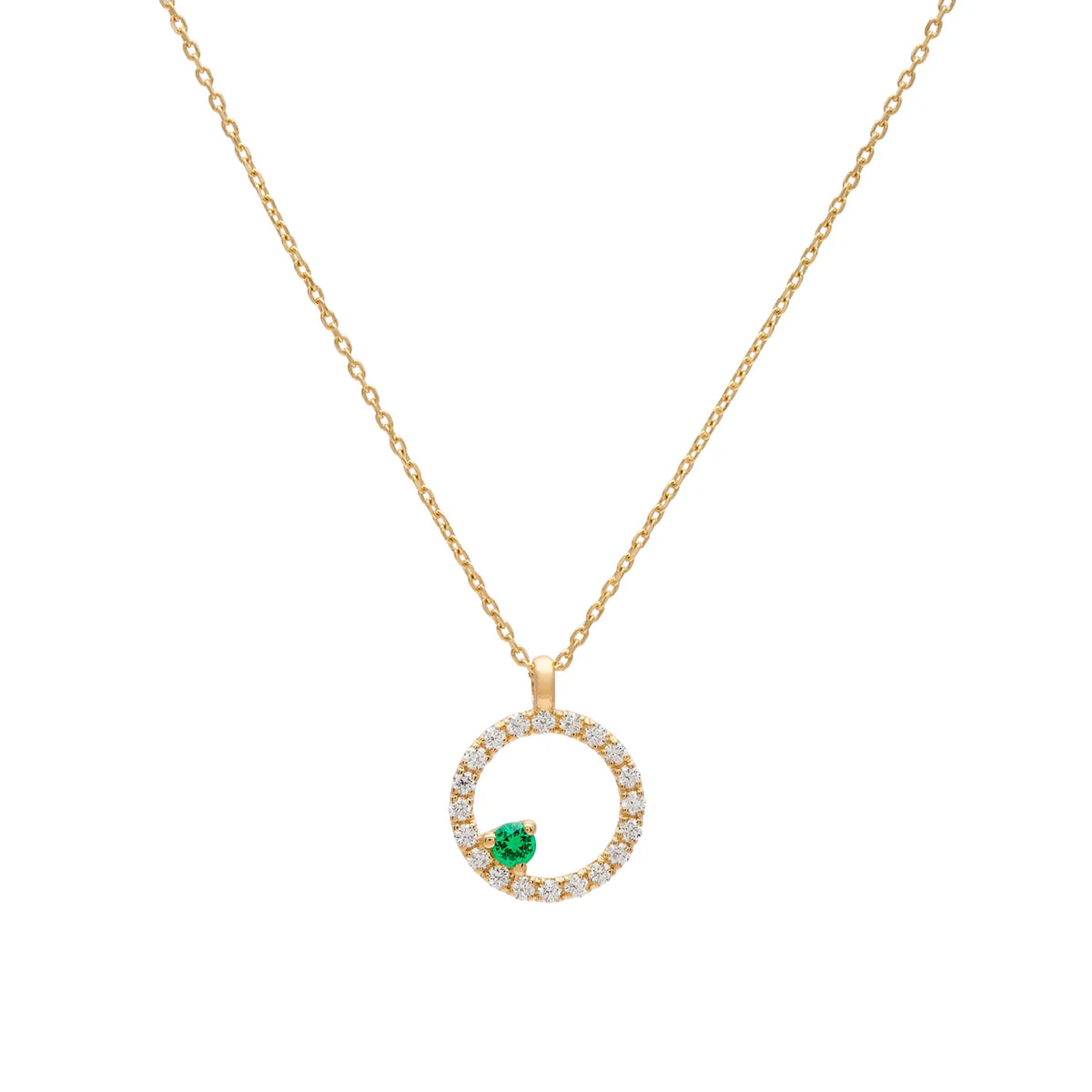 Colgante circular de brillantes y tsavorita. El motivo verde se sitúa en la parte inferior del aro luminoso.