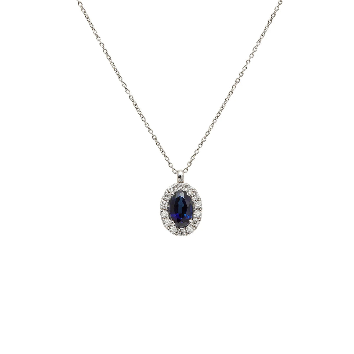 Colgante oval azul con halo. Las pequeñas piedras incoloras siguen el contorno de la piedra principal.