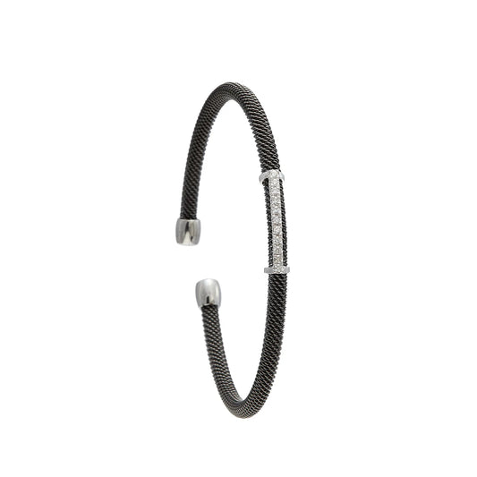 Pulsera de acero, oro y brillantes. El motivo frontal sigue una línea ligeramente curva.