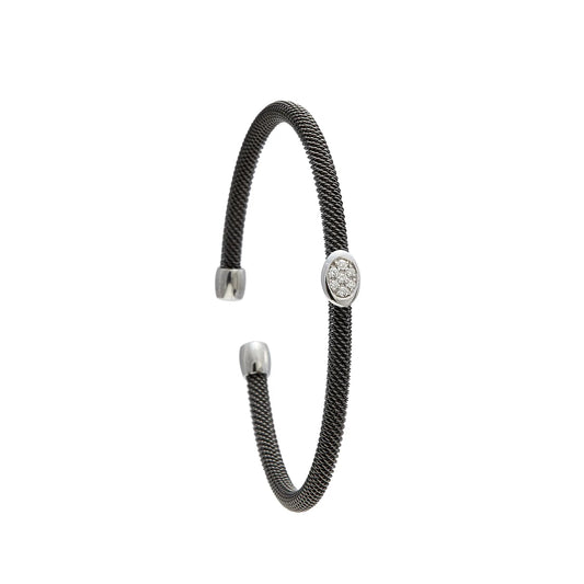 Pulsera de acero y oro con óvalo de brillantes. El motivo central reúne pequeñas piedras en una forma alargada.