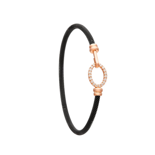 Pulsera de acero y oro con óvalo de luz. El motivo central conserva un espacio interior abierto.