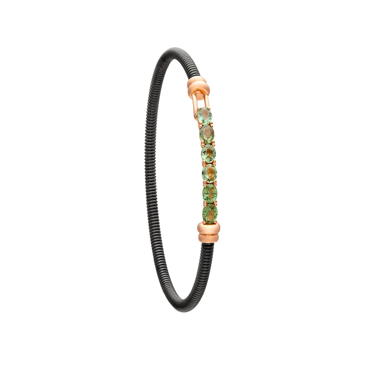 Pulsera de acero y oro con zafiros verdes. Las pequeñas monturas siguen una línea alargada.