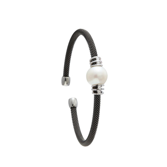 Pulsera de acero con motivo nacarado. Los detalles lisos y luminosos se distribuyen a ambos lados del centro.