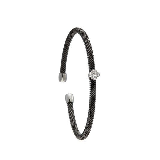 Pulsera de acero con motivo romboidal. Las piedras incoloras se agrupan en el centro del diseño.