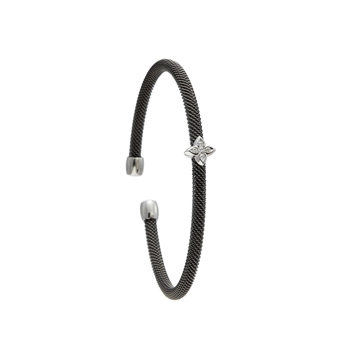Pulsera de acero y motivo estrellado. Las puntas del centro recortan su contorno luminoso.