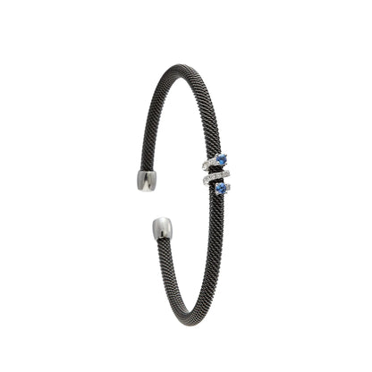 Pulsera de acero con pequeños centros azules. Las monturas del frente dibujan una sucesión vertical.