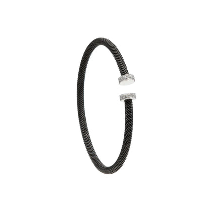Pulsera de acero con extremos luminosos. Los remates presentan pequeños destellos de tono claro.