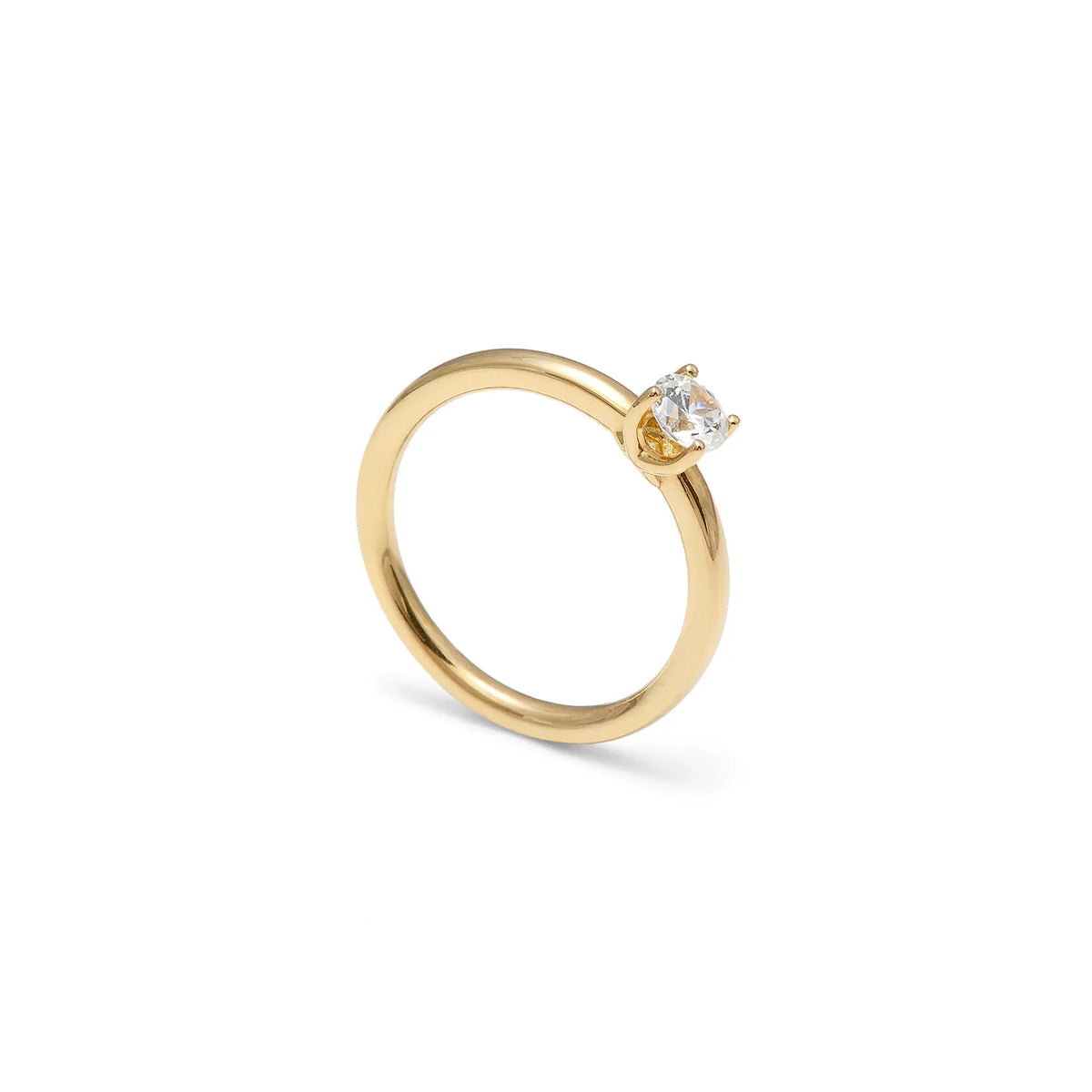 Solitario de tono dorado y centro de luz. La montura central presenta garras visibles de contorno curvo.